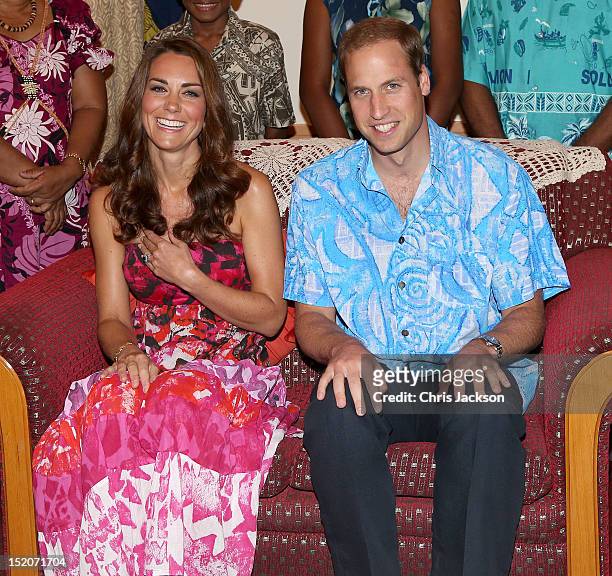 Catherine, Duchess of Cambridge and Prince William, Duke of Cambridge pose wearing traditional island clothing during a visit to the Governor...