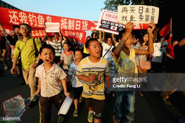 Chinese protestors stage an anti Japan rally outside the Japan Embassy on September 16, 2012 in Beijing, China. Protests have taken place across...