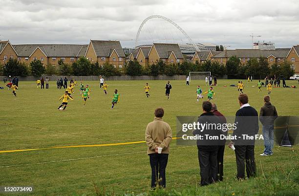 Parents watch their children play football during the launch of the Football Foundation Respect Equipment Scheme at GEC Sports Ground on 16...