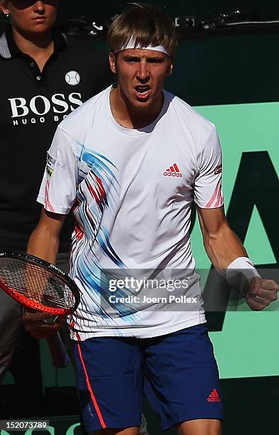 Cedrik-Marcel Stebe of Germany celebrates during his match against lleyton Hewitt of Australia during the Davis Cup World Group Play-Off match...