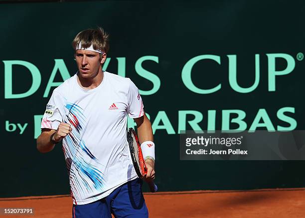 Cedrik-Marcel Stebe of Germany celebrates during his match against lleyton Hewitt of Australia during the Davis Cup World Group Play-Off match...
