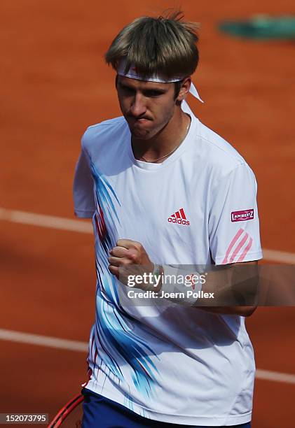 Cedrik-Marcel Stebe of Germany celebrates during his match against lleyton Hewitt of Australia during the Davis Cup World Group Play-Off match...