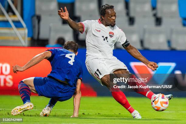 Levi García of Trinidad and Tobago shoots the ball past Matt Miazga of United States during their game at Bank of America Stadium on July 02, 2023 in...