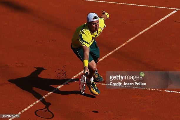 Lleyton Hewit of Australia returns the ball to Cedrik-Marcel Stebe of Germany during the Davis Cup World Group Play-Off match between Germany and...