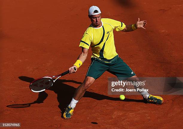 Lleyton Hewit of Australia returns the ball to Cedrik-Marcel Stebe of Germany during the Davis Cup World Group Play-Off match between Germany and...