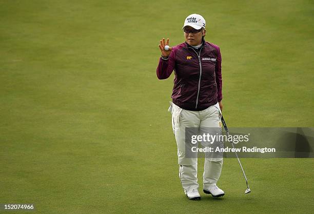 Jiyai Shin of South Korea waves to the crowd on the 18th hole during the third round of the Ricoh Women's British Open at Royal Liverpool Golf Club...
