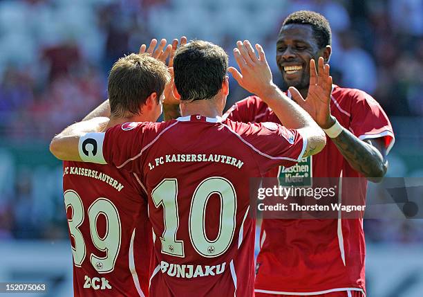 Players of Kaiserslautern celebrates after Hendrick Zuck is scoring his teams first goal during the second Bundesliga match between 1.FC...
