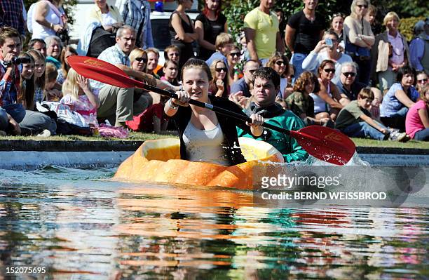 Inka Endrizzi paddles in a hollowed out pumpkin as she takes part in the German Pumpkin Boat Championship on September 16, 2012 in Ludwigsburg,...