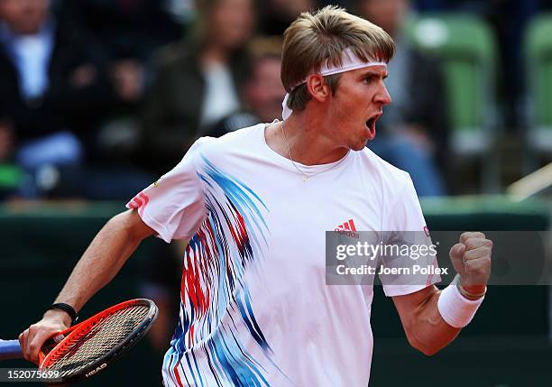 Cedrik-Marcel Stebe of Germany celebrates during his match against Lleyton Hewitt of Australia during the Davis Cup World Group Play-Off match...