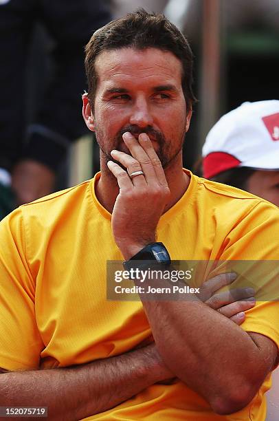 Davis Cup team captain Pat Rafter of Australia looks on during Lleyton Hewitt's match against Cedrik-Marcel Stebe of Germany during the Davis Cup...