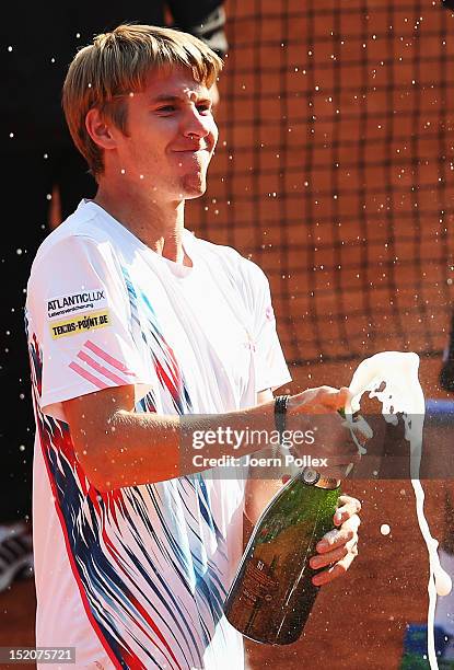 Cedrik-Marcel Stebe of Germany celebrates after winning his match against Lleyton Hewitt of Australia during the Davis Cup World Group Play-Off match...