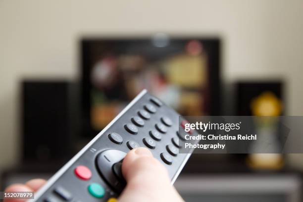 tv channel zapping - people watching tv stock pictures, royalty-free photos & images