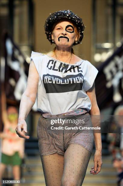 Designer Vivienne Westwood walks on the catwalk by Vivienne Westwood Red Label on day 3 of London Fashion Week Spring/Summer 2013, at the British...