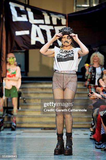 Designer Vivienne Westwood walks on the catwalk by Vivienne Westwood Red Label on day 3 of London Fashion Week Spring/Summer 2013, at the British...