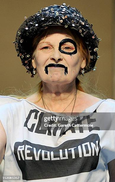 Designer Vivienne Westwood walks on the catwalk by Vivienne Westwood Red Label on day 3 of London Fashion Week Spring/Summer 2013, at the British...