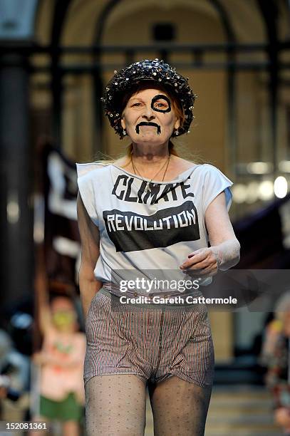 Designer Vivienne Westwood walks on the catwalk by Vivienne Westwood Red Label on day 3 of London Fashion Week Spring/Summer 2013, at the British...