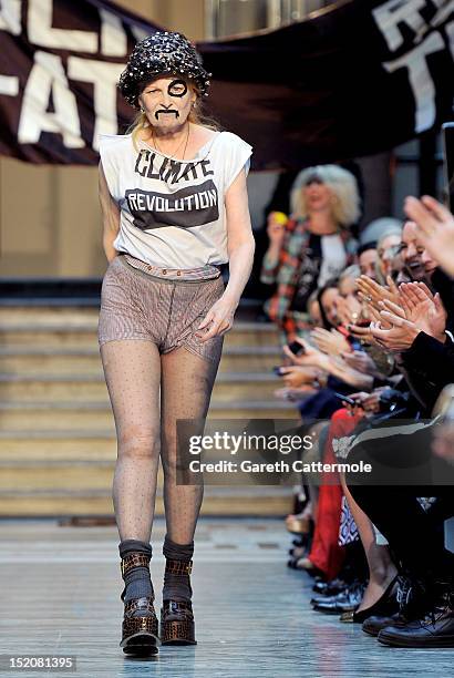 Designer Vivienne Westwood walks on the catwalk by Vivienne Westwood Red Label on day 3 of London Fashion Week Spring/Summer 2013, at the British...