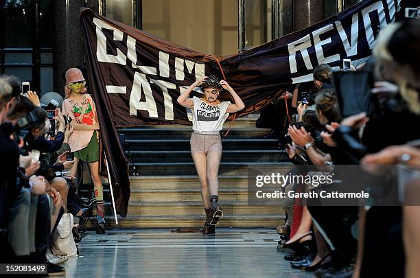 Designer Vivienne Westwood walks on the catwalk by Vivienne Westwood Red Label on day 3 of London Fashion Week Spring/Summer 2013, at the British...