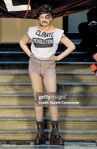 Designer Vivienne Westwood walks on the catwalk by Vivienne Westwood Red Label on day 3 of London Fashion Week Spring/Summer 2013, at the British...