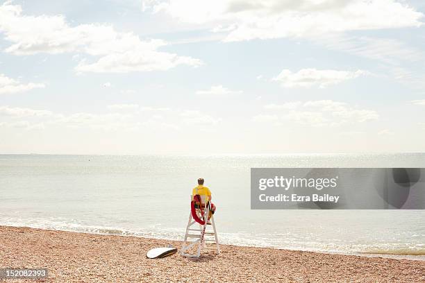 lifeguard looking out to sea - the lifeguard stock pictures, royalty-free photos & images