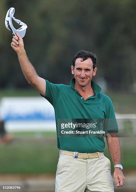 Gonzalo Fernandez Castano of Spain celebrates on the 18th hole after winning the BMW Italian open at Royal Park Golf & Country Club on September 16,...