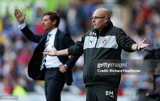 Brian McDermott, manager of Reading gestures with Andre Villas-Boas, manager of Tottenham Hotspur during the Barclays Premier League match between...