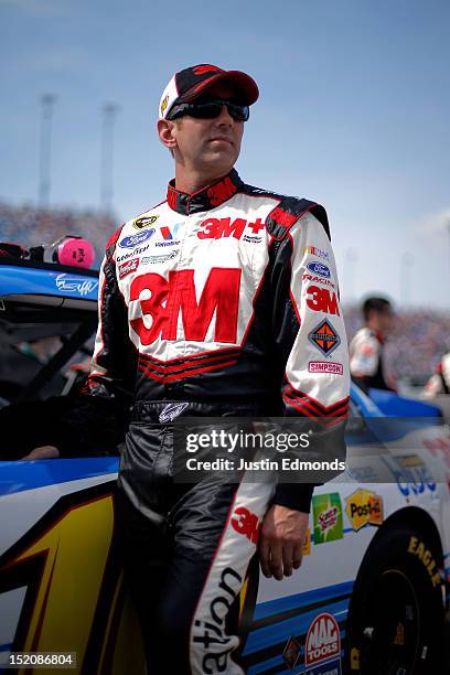 Greg Biffle, driver of the Scotch Blue Ford, looks on from the grid prior to the start of during the NASCAR Sprint Cup Series GEICO 400 at...