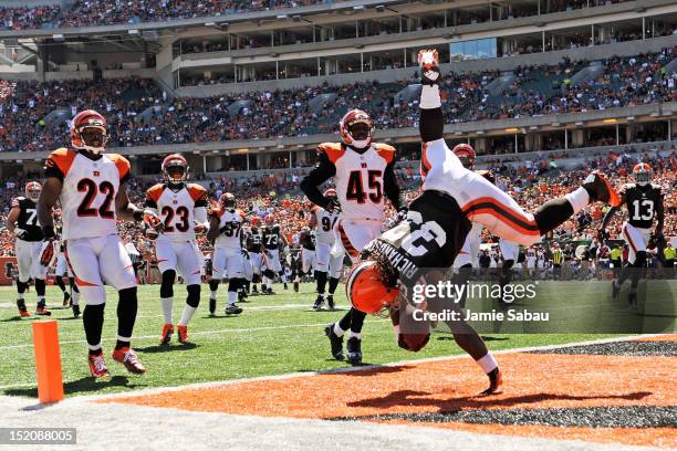 Trent Richardson of the Cleveland Browns flips into the endzone at the end of a 32-yard touchdown run in the first half against the Cincinnati...