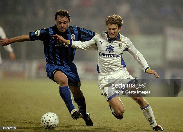 Jesper Blomqvist of Parma AC takes on Giovanni Pinchentini of Atalanta Bergamasca Calcio during a Serie A match at the Comunale Stadium in Bergamo,...