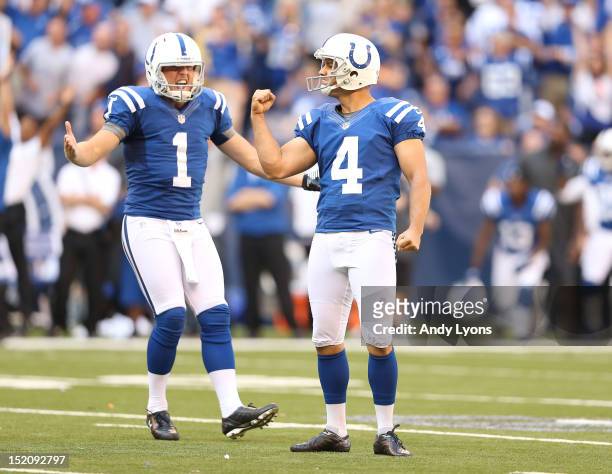 Adam Vinatieri of the Indianapolis Colts and Pat McAfee celebrate after Vinatieri made the game winning 53 yard field goal during the NFL game...