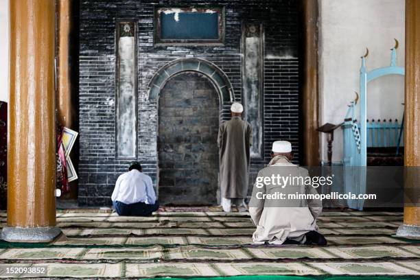 praying - kyrgyzstan stock pictures, royalty-free photos & images