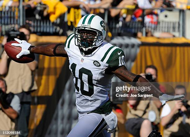 Santonio Holmes of the New York Jets reacts after scoring a first quarter touchdown against the Pittsburgh Steelers on September 16, 2012 at Heinz...