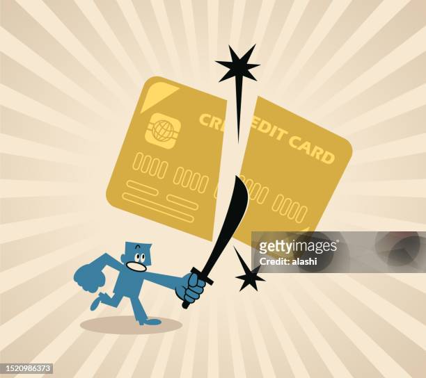 a man cutting off a credit card with a knife or sword - wasting money stock illustrations