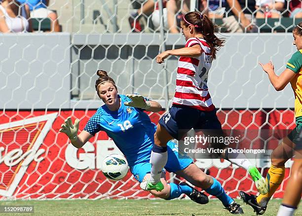 Alex Morgan of the USA tries to play the ball past goalkeeper Brianna Davey of Australia in the second half during the international friendly match...