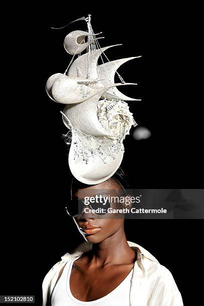 Model showcases designs on the catwalk by Philip Treacy on day 3 of London Fashion Week Spring/Summer 2013, at The Royal Courts Of Justice on...