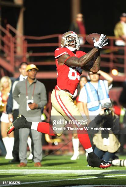 Vernon Davis of the San Francisco 49ers catches a twenty one yard touchdown pass in the first quarter against the Detroit Lions at Candlestick Park...