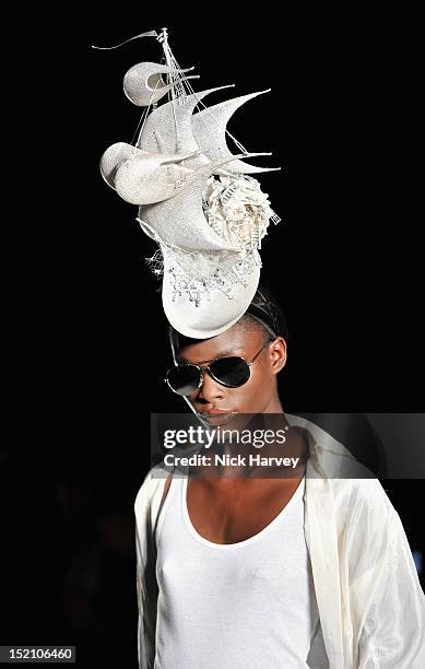 Model showcases designs on the catwalk by Philip Treacy on day 3 of London Fashion Week Spring/Summer 2013, at The Royal Courts Of Justice on...