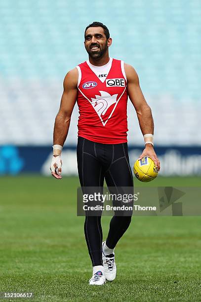 Adam Goodes of the Swans shares a joke with a team mate during a Sydney Swans AFL training session at ANZ Stadium on September 17, 2012 in Sydney,...