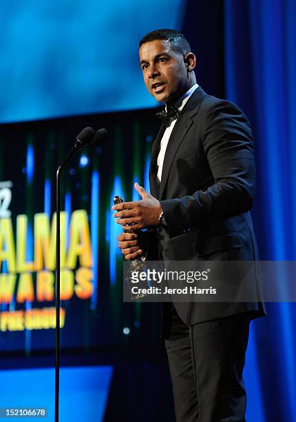 Actor Jon Huertas accepts the Favorite TV Actor Supporting Role in a Drama award at the 2012 NCLR ALMA Awards Pre-Show at Pasadena Civic Auditorium...