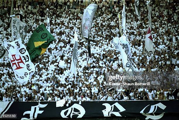 The Vasco de Gama fans watch the action during the World Club Championship match against Manchester United played at the Maracana Stadium in Rio de...