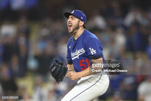 Alex Vesia of the Los Angeles Dodgers celebrates after closing out the ninth inning to defeat the Pittsburgh Pirates, 5-2, at Dodger Stadium on July...