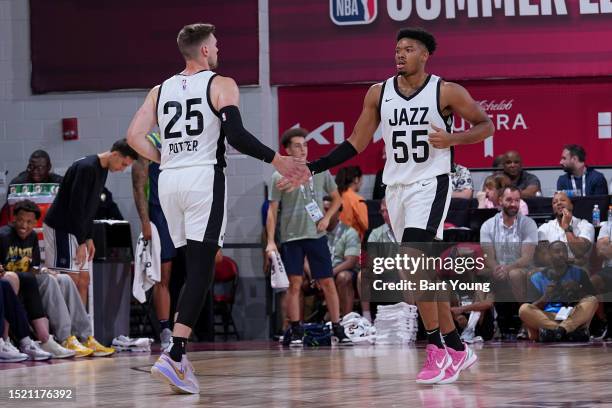 Ed Crosswell of the Utah Jazz high fives Micah Potter of the Utah Jazz during the game against the Minnesota Timberwolves during the 2023 NBA Las...