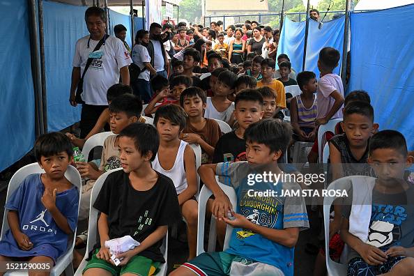Tuli Rite Boys wait for their turn during a mass circumcision event in Manila ...