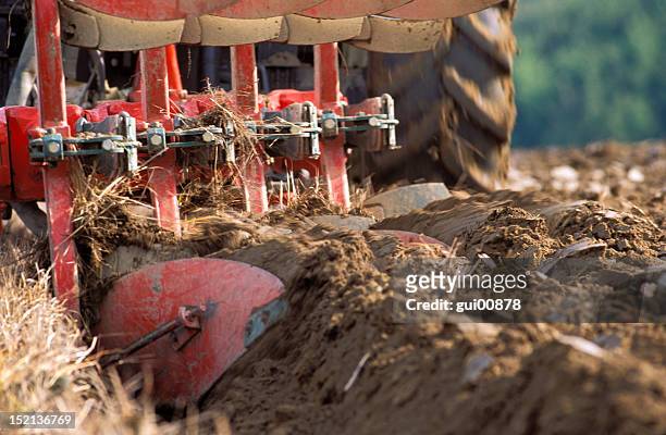 tractor ploughing - plowed field stock pictures, royalty-free photos & images