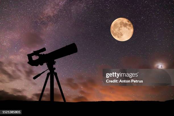 telescope on the background of the starry sky and moon. amateur astronomy and space exploration - astrophysics fotografías e imágenes de stock