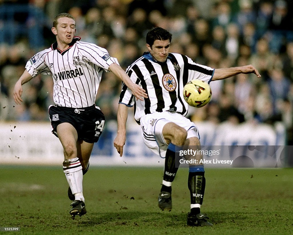 Andy Parkinson of Tranmere Rovers challenges Aaron Hughes of Newcastle United