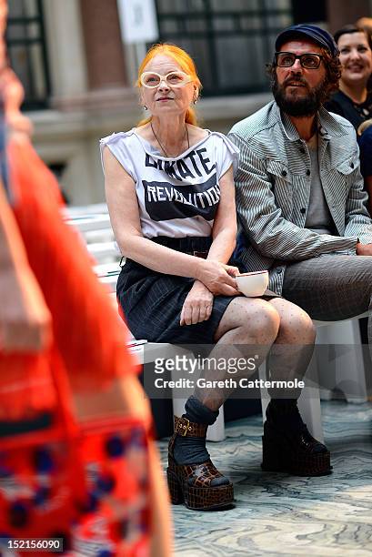 Designer Vivienne Westwood and Andreas Kronthaler watch models rehearse before her Red Label show on day 3 of London Fashion Week Spring/Summer 2013,...