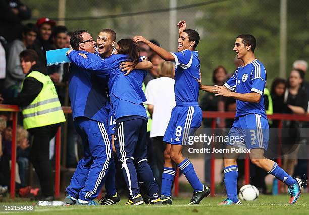 Shon Weissman of Israel celebrates with his team mates after scoring his team's first goal during the Under 17 KOMM MIT 4-Nations tournament match...