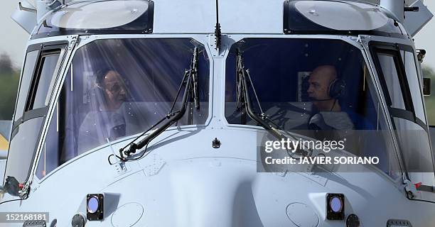 An NH90 helicopter carrying Spain's King Juan Carlos lands at the Cuatro Vietos Military Air Base in Madrid on September 17, 2012 during a press...