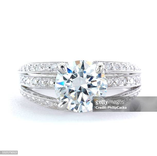 woman's diamond and platinum wedding ring - diamond ring stock pictures, royalty-free photos & images